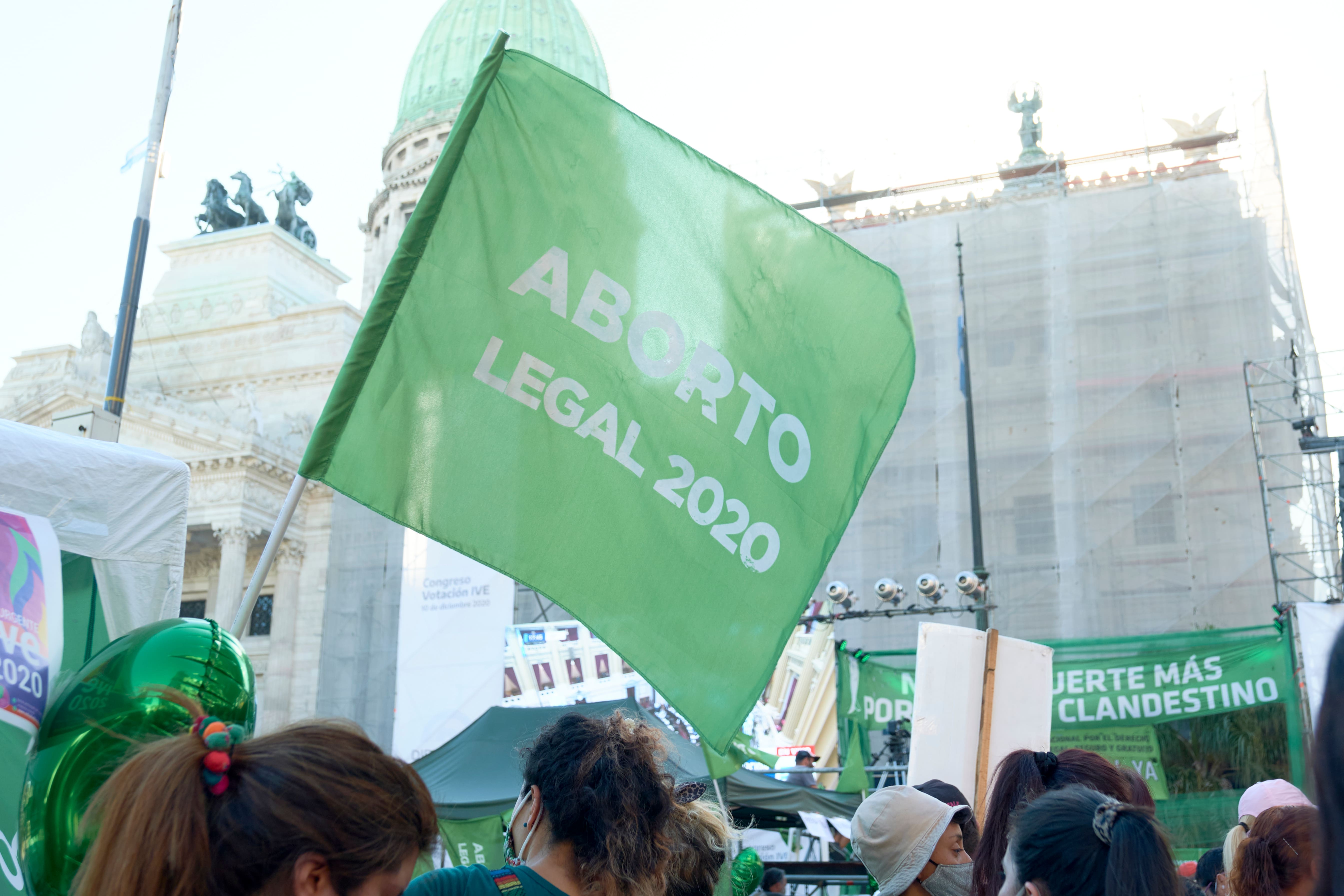 A flagg with the words Aborto Legal 2020 (Legal Abortion 2020) flies in front of the Argentinian Parliament. 
